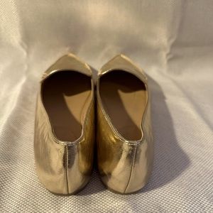Gold pointed toe flats